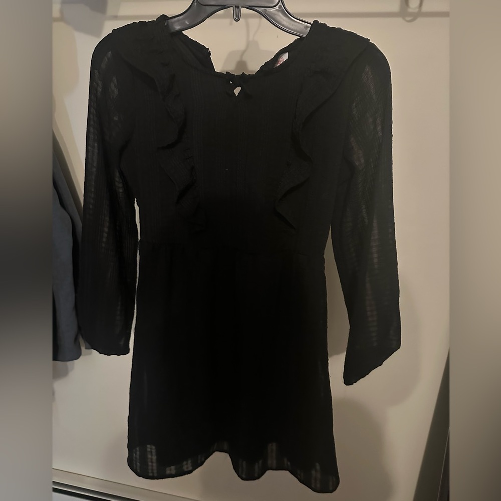Girls black dress. Arms are see through falls to knee length. L 10/12